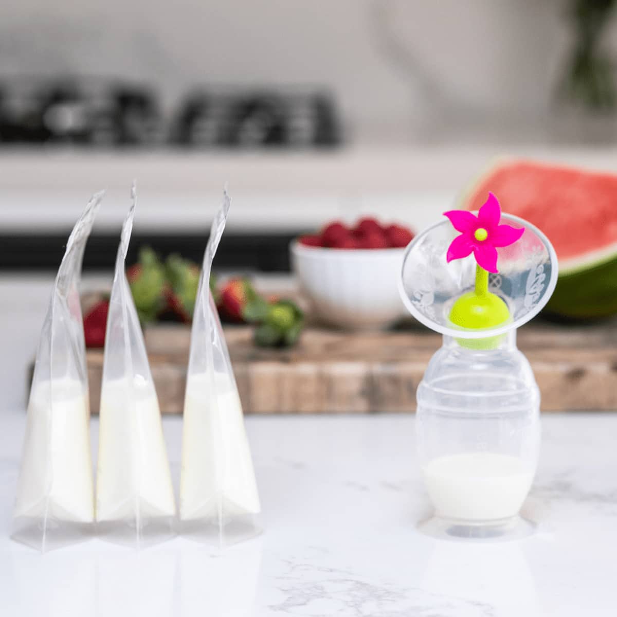 Haakaa Silicone Breast Pump with Suction Base and Flower Stopper - Pink