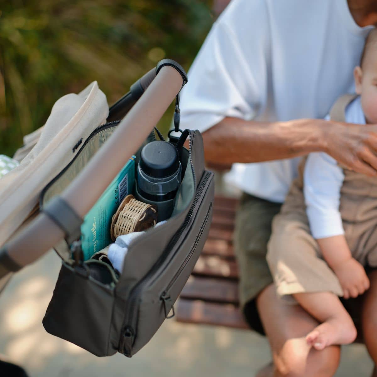 OiOi Weatherproof Multitasker Pram Caddy - Black